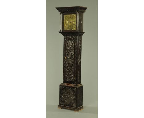 An early 18th century oak longcase clock, the square brass dial inscribed for Jon Bell, Carlisle, the dial with Roman and Ara