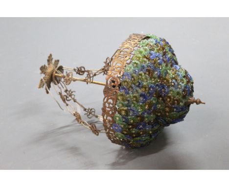 A glass and metal ceiling hanging light fitting, decorated with green, blue and yellow petals.  +/- 56 cm (425).
