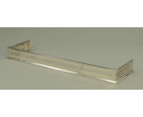 A steel fender, pierced.  Internal dimensions 150 cm x 43 cm.