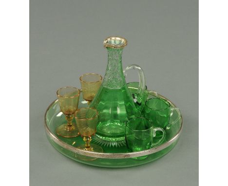 A green glass silver mounted liqueur flask, hallmarked to the rim London 1894, the accompanying bowl similarly hallmarked but