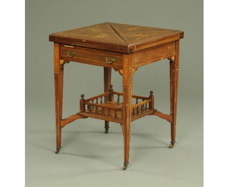 An Edwardian inlaid mahogany square envelope card table, with frieze drawer and tapered legs of square section united by a ga