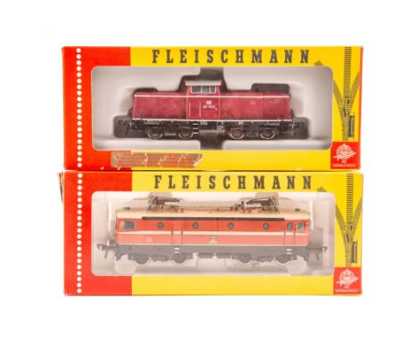 2 Fleischmann HO locomotives. A DB class 212 Bo-Bo centre cab diesel locomotive 212-181-2 in maroon, grey and black livery. P