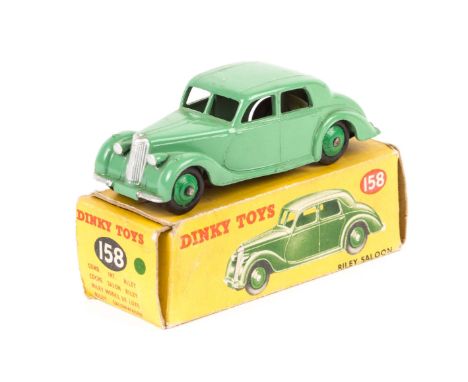 A Dinky Toys Riley Saloon (158). In light green with mid green wheels. Boxed, some wear. Vehicle VGC, minor marks only. Plate