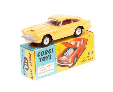 Corgi Aston Martin D.B.4 (218). Example in yellow with red interior, smooth spun wheels. Boxed, minor wear. Vehicle Mint. Pla