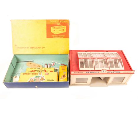 A Dinky Toys Service Station (Moulded Kit) (785). A constructed example, in beige with red roof and glazed sky-lights. Roller