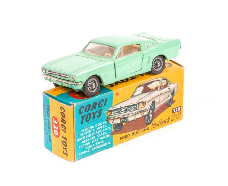 Corgi Ford Mustang Fastback 2+2 (320). An example in light green with cream interior, fitted with spoked wheels. Boxed, minor