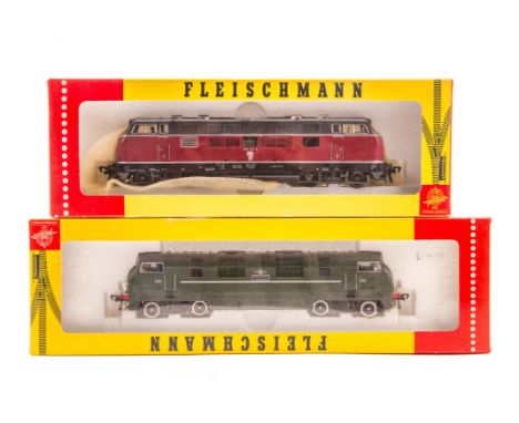 2 Fleischmann HO diesel locomotives. A DB Bo-Bo diesel hydraulic locomotive 221-131-6 in maroon and grey livery. Plus a BR Wa