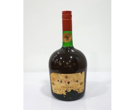 COURVOISIER 3 STAR LUXE COGNAC CIRCA 1970A larger than usual bottle of Courvoisier 3 Star Luxe Cognac which we estimate as be