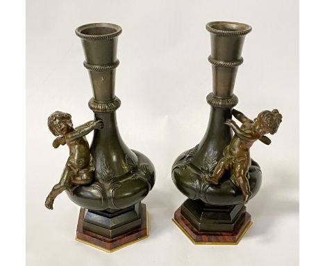 PAIR BRONZE CHERUB VASES WITH MARBLE BASES 27CMS (H) APPROX