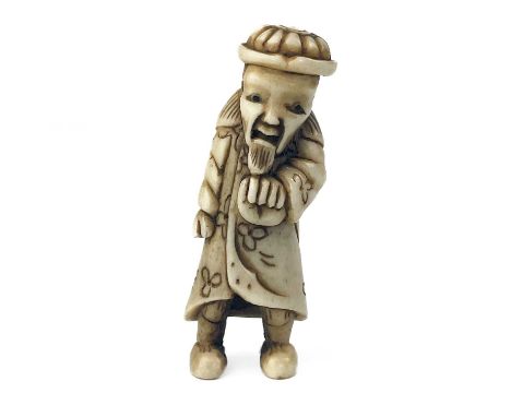 A Japanese carved bone netsuke modelled as a sage. Length 5.5cm, width 2cm.