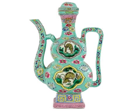 A Chinese porcelain teapot, Qianlong mark, 18th/19th century. The turquoise body with painted enamel floral decoration and fa