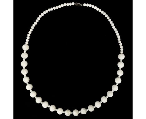 A Chinese white jade bead necklace with 9ct gold clasp. The necklace with round fluted beads separated by smaller beads, the 