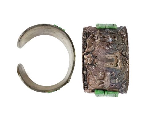 A Chinese silver and jade cuff bangle. Cast and chased with figures and vessals, with two green jade applied characters, stam