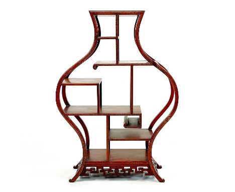 A Chinese silver wire inlaid display stand, early 20th century. With an arrangement of shelves on splay feet, height 78cm, wi