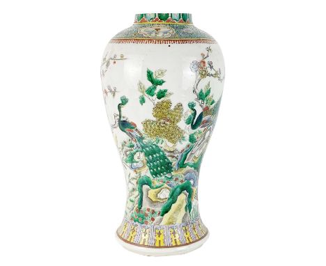 A large Chinese famille verte porcelain vase, 19th century. With painted enamel decoration of peacocks perched on flowering b