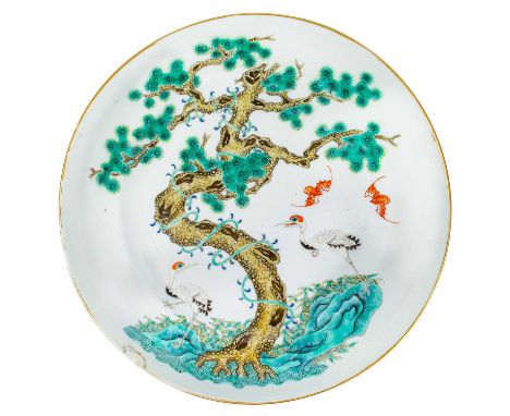 A Chinese famille verte porcelain dish, red Daoguang seal.  Painted enamel decoration of a large tree, two cranes and two bat