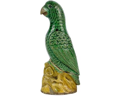 A Chinese porcelain model of a parrot, 19th century. Part of old paper label to base, height 10.5cm, width 3cm, depth 4.5cm.T