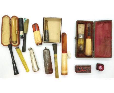 Box of mixed cigarette and cigar holders including one in a silver case (12). P&amp;P Group 1 (£14+VAT for the first lot and 