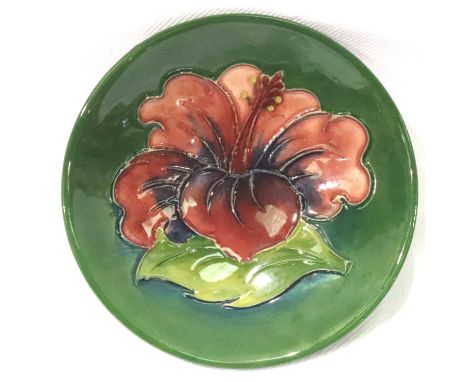 Moorcroft green ground Hibiscus footed pin dish, D: 70 mm. P&amp;P Group 1 (£14+VAT for the first lot and £1+VAT for subseque