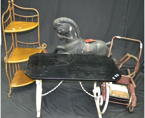 A vintage rocking horse; a metalwork three tier corner whatnot; a metalwork coffee table; a vintage pushchair