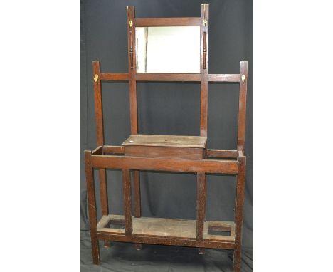 An oak hall stand, rectangular mirror flanked by hooks, glove box and stick stands to base, circa 1940. 174cm high x 102cm x 