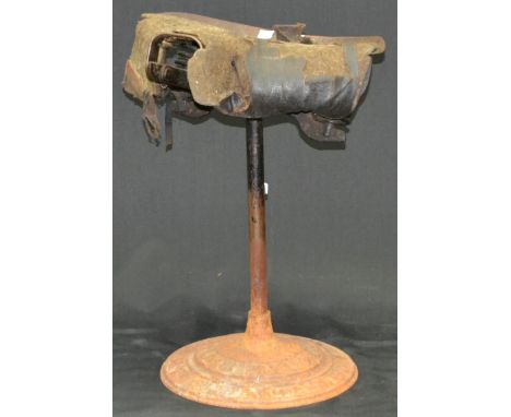 A vintage cast iron stool - The Ex'all Spring Saddle.