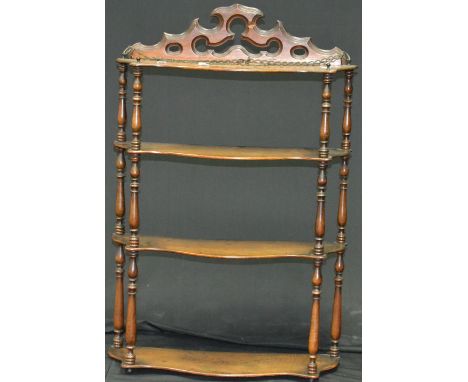 An Edwardian mahogany bow front wall shelf