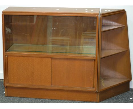 A G-Plan style teak cabinet, two sliding glass doors over two sliding wooden doors; a three tier corner shelf. (2)