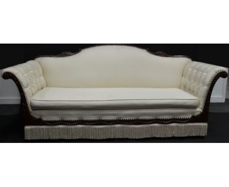 A reproduction three seat hotel lobby sofa, carved cresting