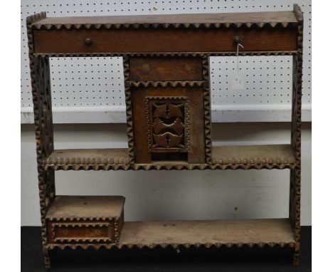 A Victorian chip carved wall shelf, with drawers