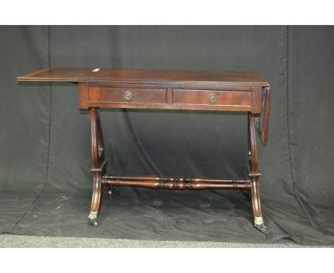 A reproduction mahogany sofa table