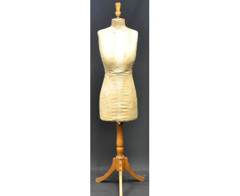 A vintage tailor's mannequin with 32" bust, 25"waist and 34" hip measurements.