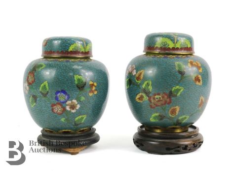 Pair of Chinese cloisonne ginger jars and covers, 20th century, decorated with flowers approx 14 cms. The jars having a turqu