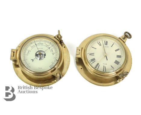 Nauticalia Saloon brass ships clock with Roman dial, approx 24 cms diameter together with a brass Nauticalia ships barometer 