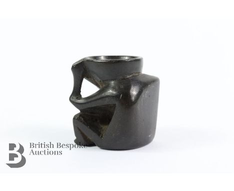 A carved ebony netsuke of a kappa, approx. 3 x 2.5cms.&nbsp;
