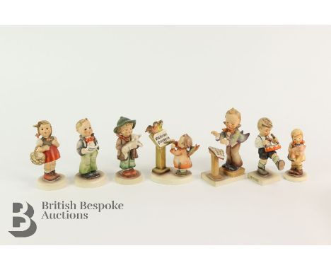 Goebel figurines, three choir figurines, figure with lamb, figure with pig, figure with drummer, figure with a basket.&nbsp;