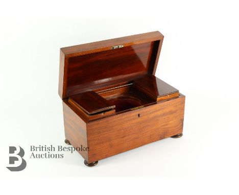 George IV mahogany tea caddy, with compartments for black and green tea with the central compartment for the glass mixing bow