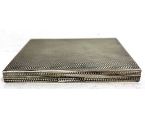 A Czechoslovakian silver cigarette case of rectangular form with overall engine turned decoration having a concealed push in 