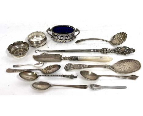 Mixed Lot:  A silver preserve spoon, a shell bowled sifter spoon, a silver long handled button hook, five small silver spoons