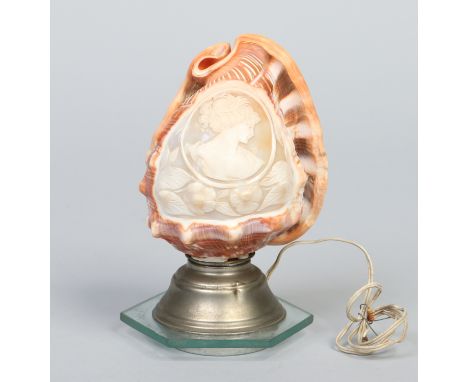 A carved conche shell cameo lamp depicting a Classical maiden, 19cm.
