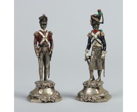 A pair of Italian cast silver figures from a series depicting 19th century military costume, cold painted in coloured enamels