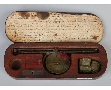 A Georgian mahogany cased set of sovereign scales. 