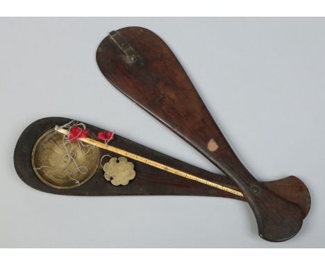 An antique set of Oriental bone and brass opium scales in folding wooden case, 34cm. 
