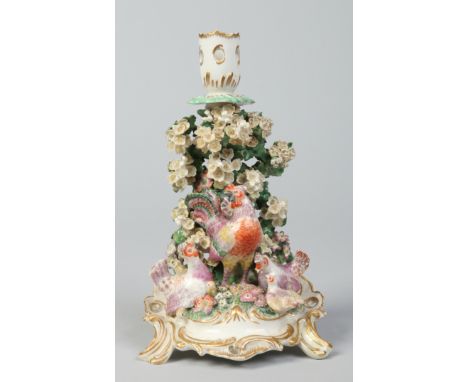 A rare Chelsea gold anchor period bocage candlestick surmounted with a cockrel, three chickens and their young and raised on 