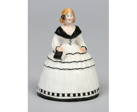 A large Royal Worcester candle snuffer, formed as a lady wearing a crinoline dress holding a prayer book and coloured in enam