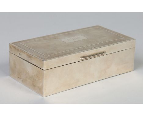 A George VI silver cigarette box with engine turned engraving. Assayed Birmingham 1943, 16.75cm wide.    Condition Report. To