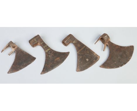 Four iron axe heads probably 16th century. Each with incised line work. Largest 17.5cm tip to tip.    Condition Report. To be