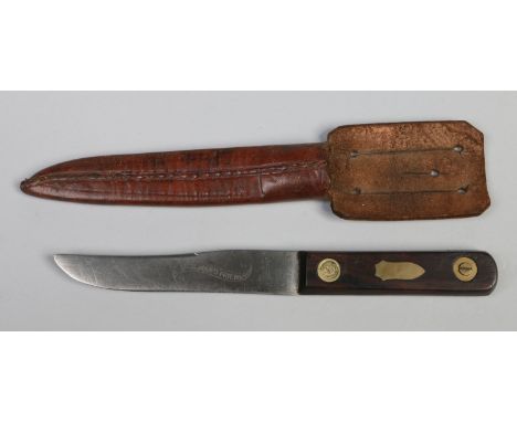 A Victorian hunting knife probably Sheffield made. In leather sheath with frog, having brass studded rosewood scales, with br