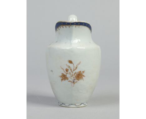 An 18th century Chinese export helmet shaped cream jug. With blue and gilt border and decorated with a gilt flower sprig, 12.