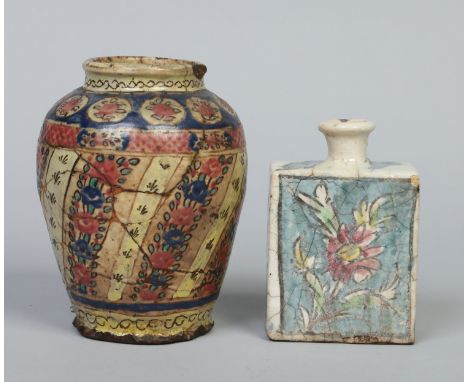 An antique Persian Iznik type high shouldered vase and similar rectangular flask. Vase 20cm.   Condition Report. To be used a